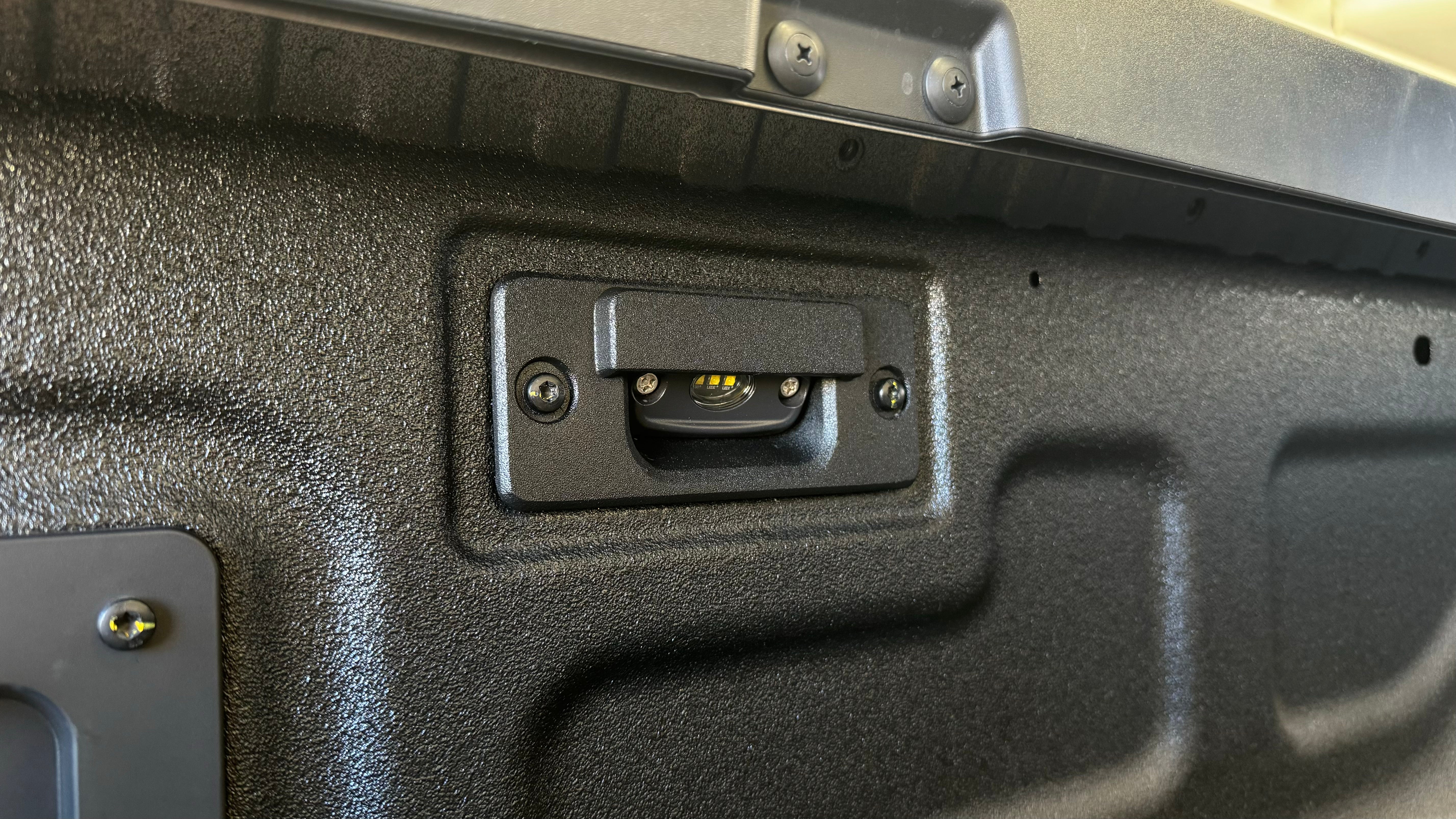 Next Gen Ranger Tub Lights Bracket installed in tray with ROK9 light mounted