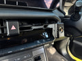 Close-up of the 3D printed bracket clipped into the Hilux N90 centre vent with mic clip screw mount