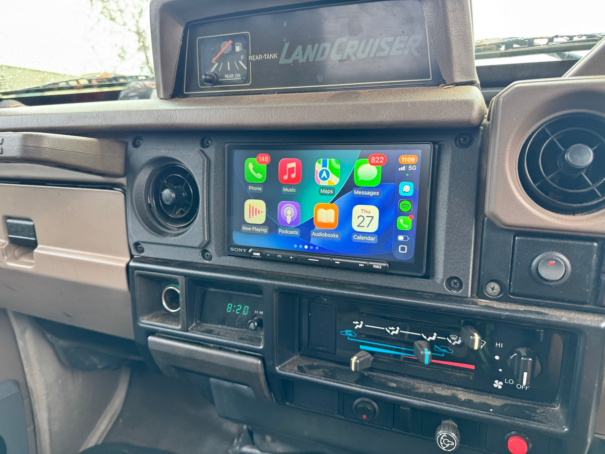 LandCruiser steel dash double-DIN fascia installed, angled dashboard view