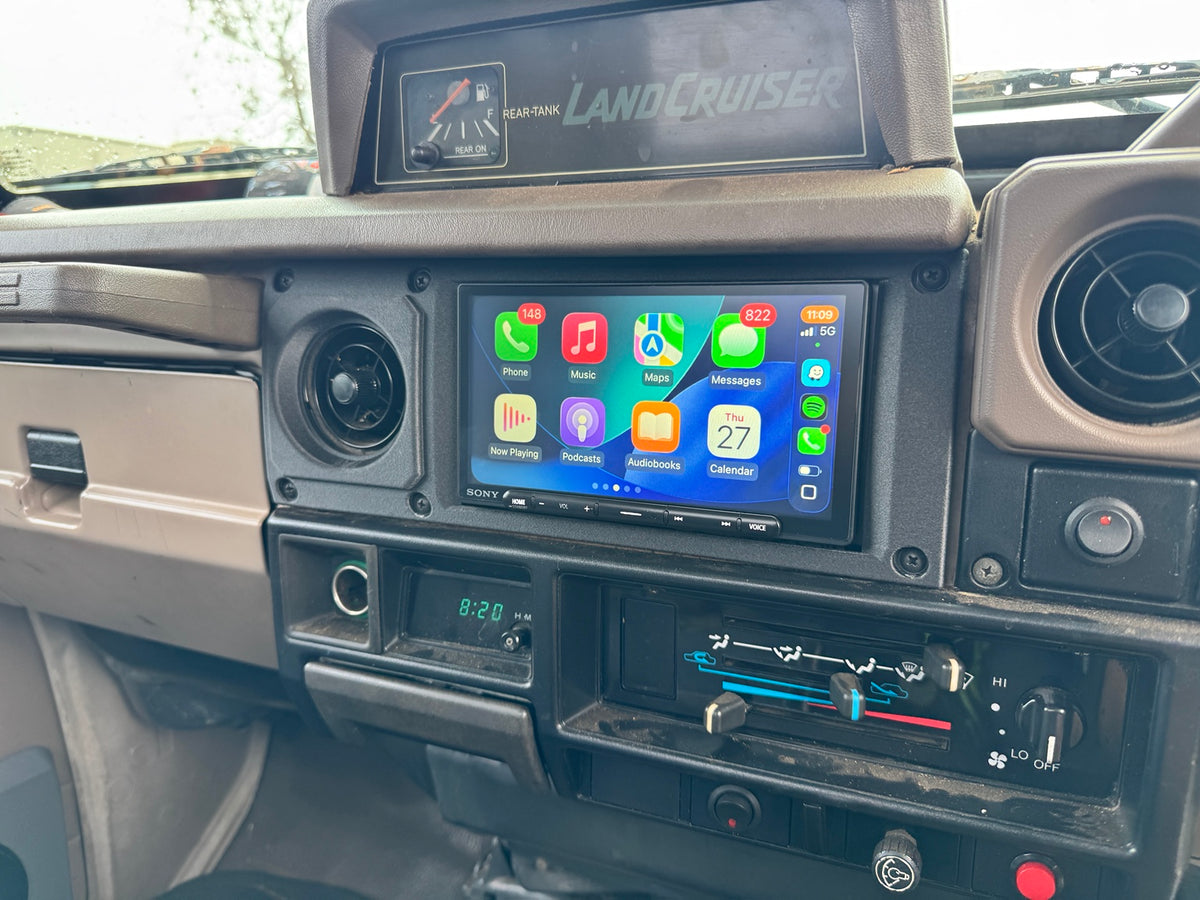 LC75 steel dash double-DIN fascia installed, wide dashboard view