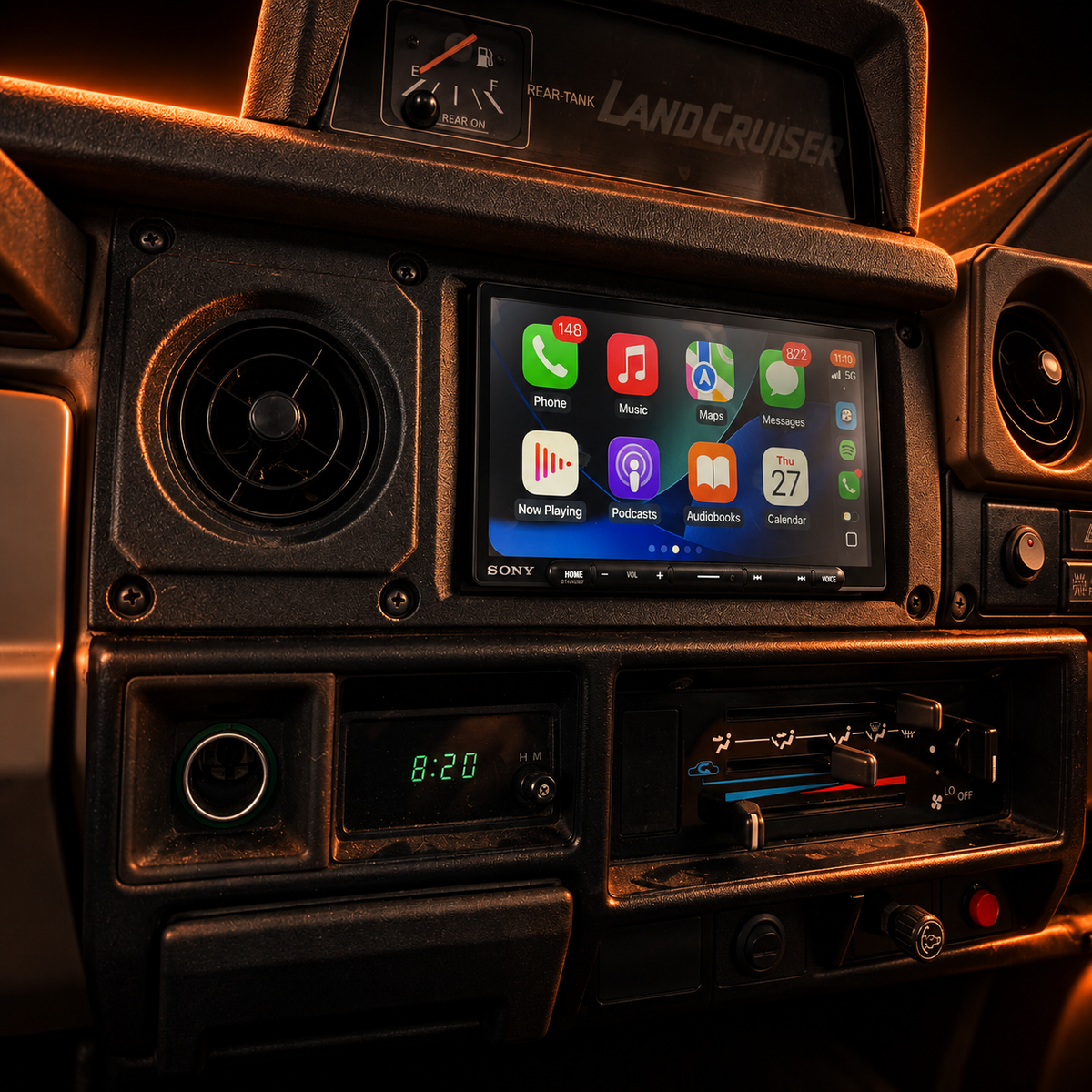 Toyota LandCruiser LC75 steel dash double-DIN fascia installed with dark orange feature lighting