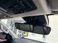 Angled interior view of the Hilux N90 overhead three-switch panel installed in the factory console